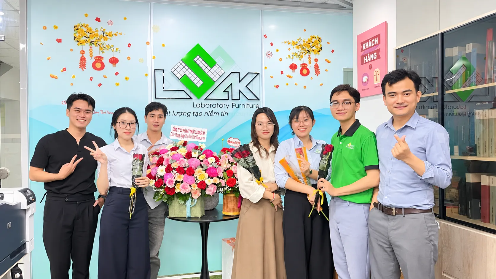 Corporate celebration with flowers and smiles 11zon